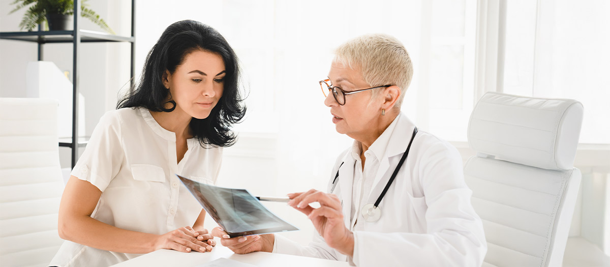 doctor and patient looking at xray